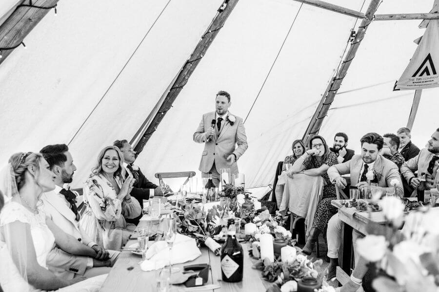 Wedding guests on their feet during a round of the game