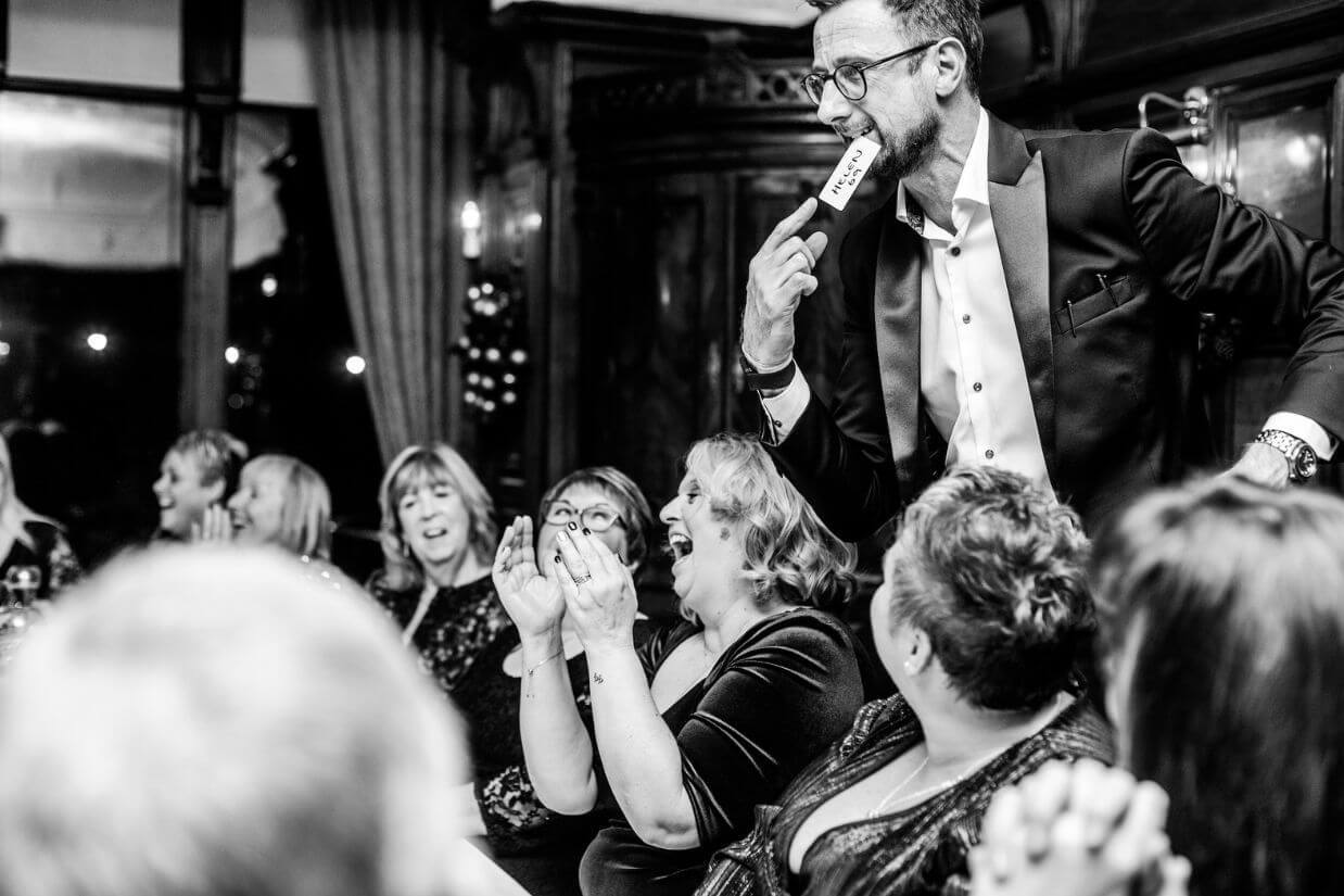 Magician for corporate events — guests laughing