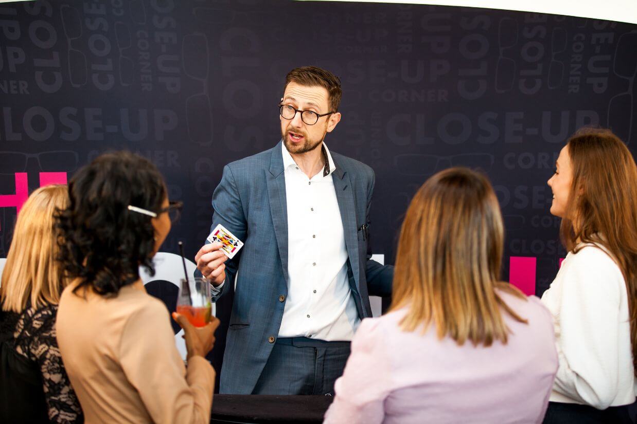 Hire a corporate magician — guests reacting