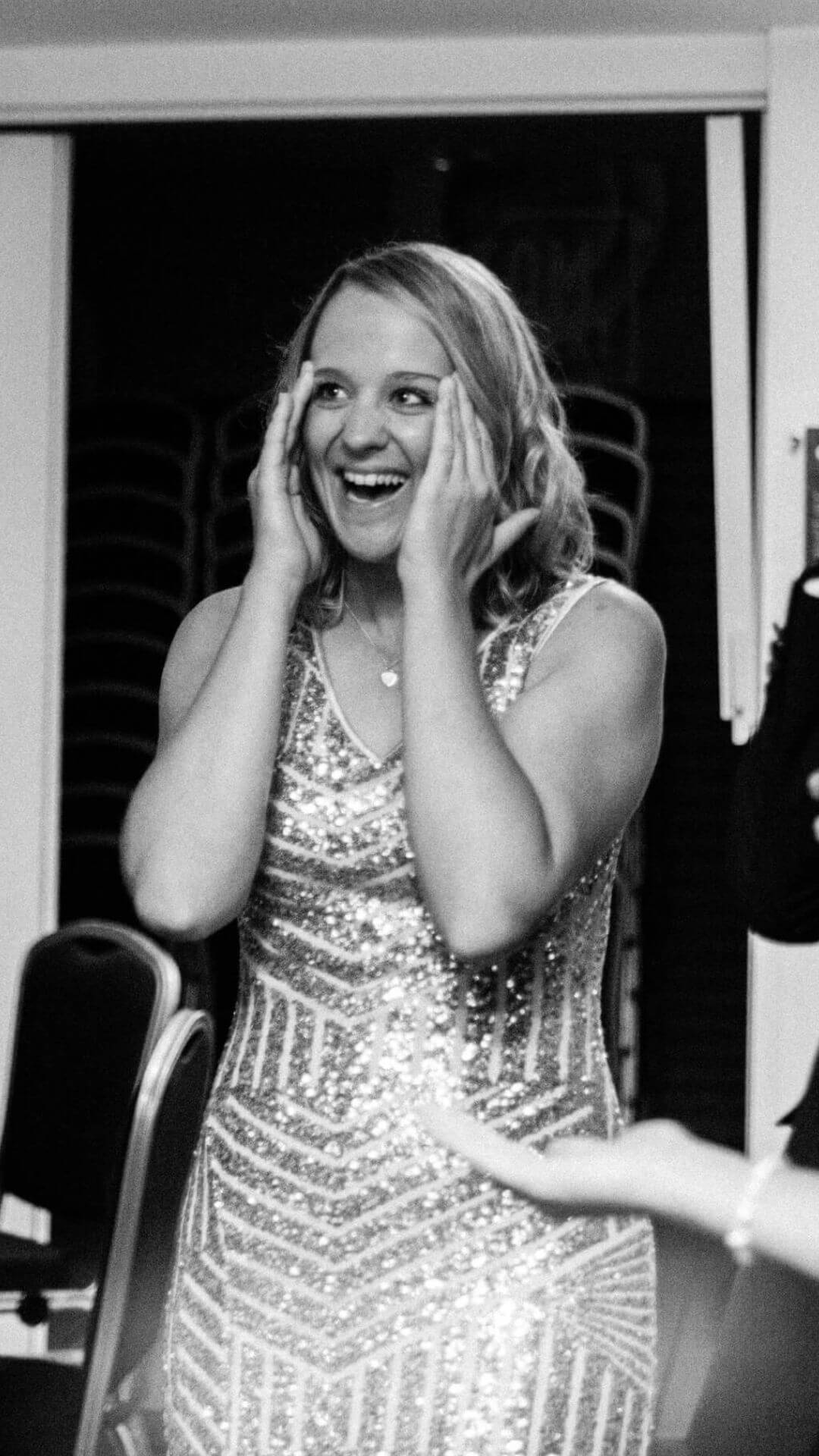 Party guest reacting to close-up magic