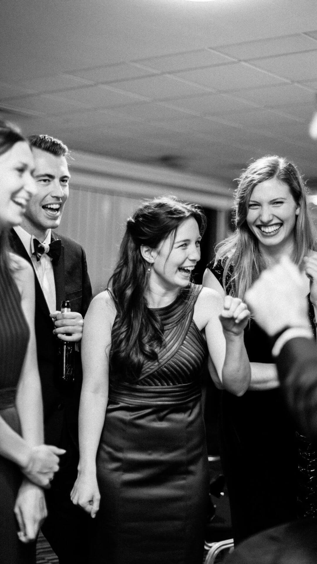 Party guests reacting to close-up magic