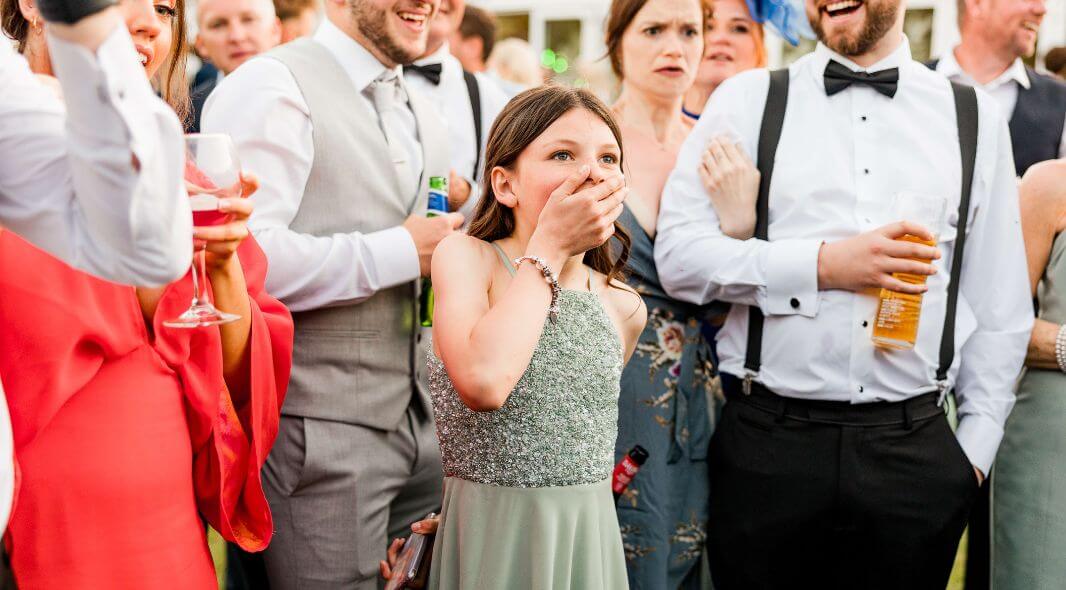 Wedding guests reacting to close-up magic