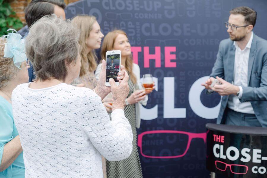 A crowd gathered around the Close-Up Corner booth