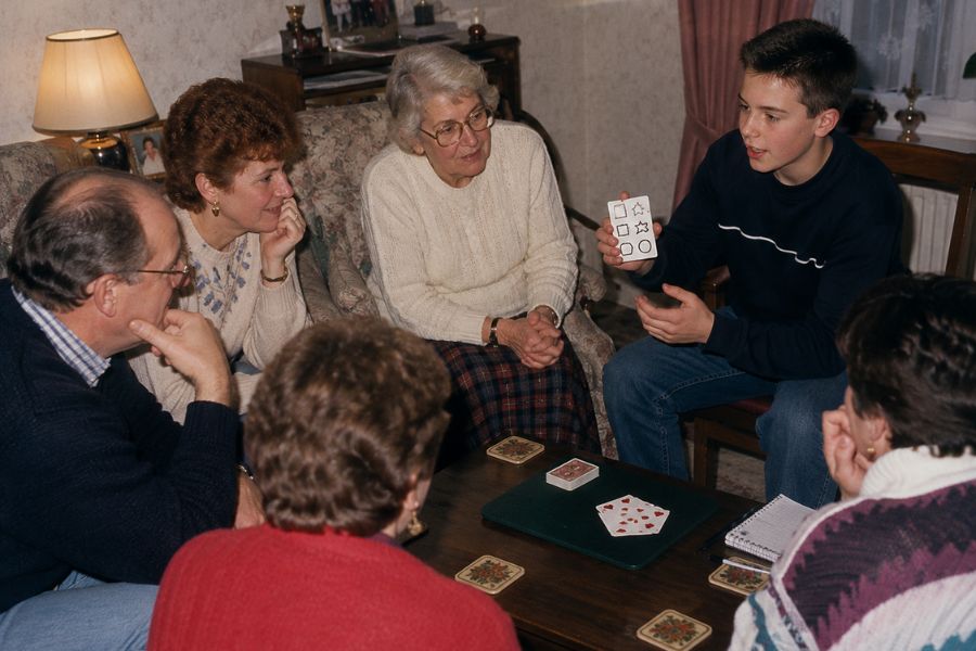 A teenage Close-Up Chris performing mentalism for family and friends