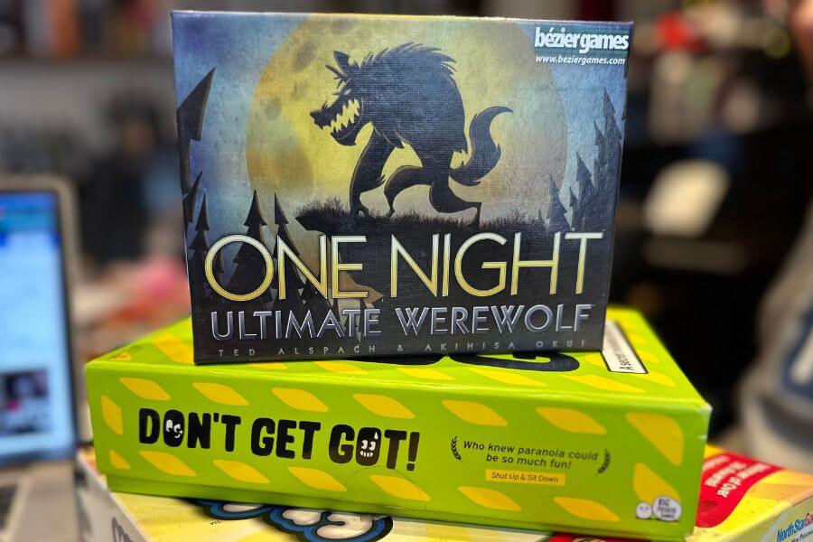 Friends playing a tabletop game at a dinner party