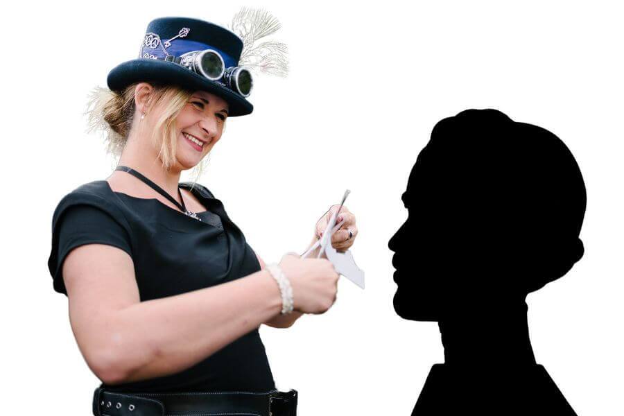 A silhouette artist cutting a paper portrait at a party