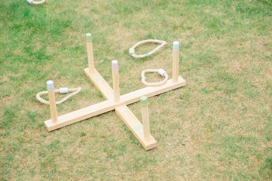 Wedding Games for Guests 4 Wedding guests playing ring toss as a garden game at the drinks reception