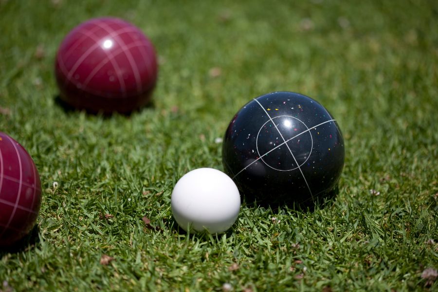 Wedding Games for Guests 17 Boules being played on the lawn at an outdoor wedding