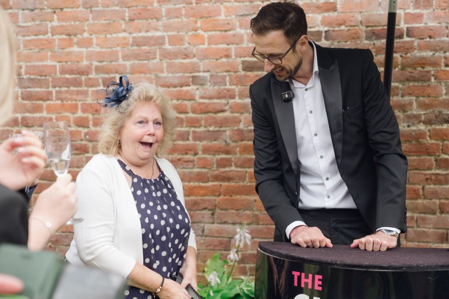 Magician commanding a room during a close-up set