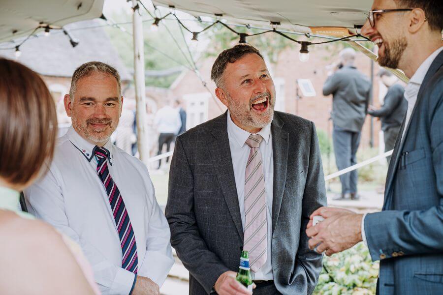 Wedding guest amazed at sleight of hand magic at Alrewas Hayes
