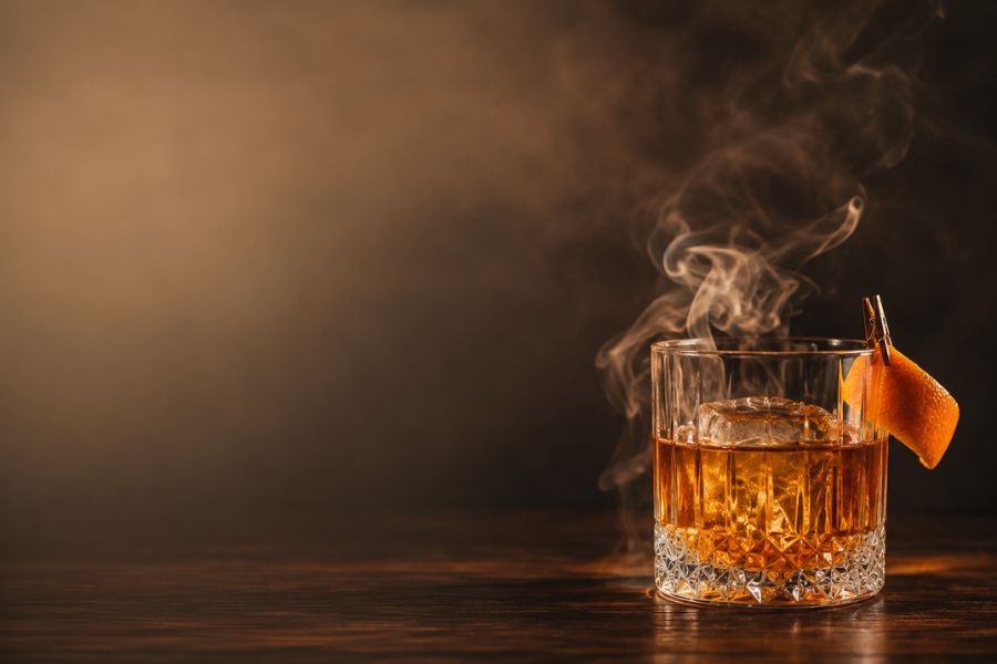 Smoky Old Fashioned cocktail served at a wedding evening reception