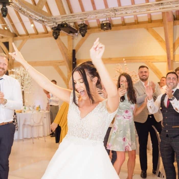 Wedding DJ keeping the dance floor packed at an evening reception