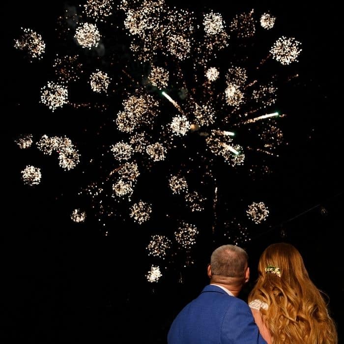 Wedding guests gathering outside for fireworks