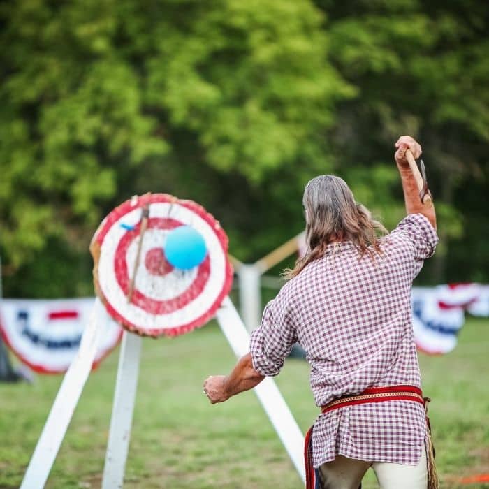 Wedding guests trying axe throwing as unusual entertainment
