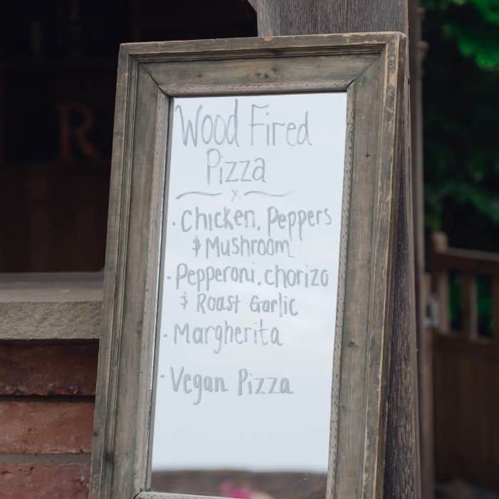 Bride eating pizza at her wedding reception