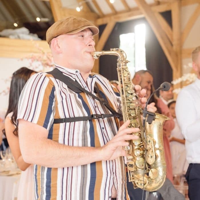 Wedding saxophonist playing a live accompaniment to the DJ set