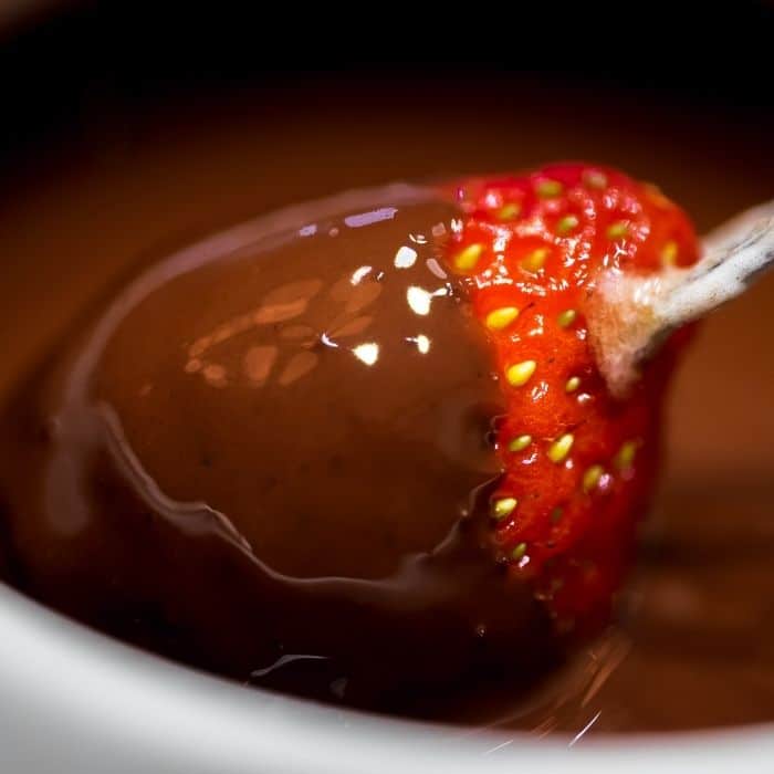 Wedding chocolate fountain with fruit and marshmallows for dipping