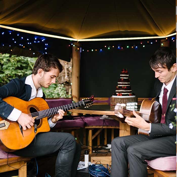 Acoustic duo performing at a small wedding