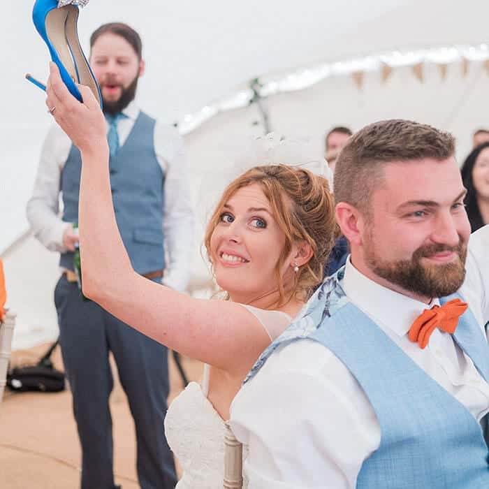 Bride and groom playing Mr and Mrs with their guests