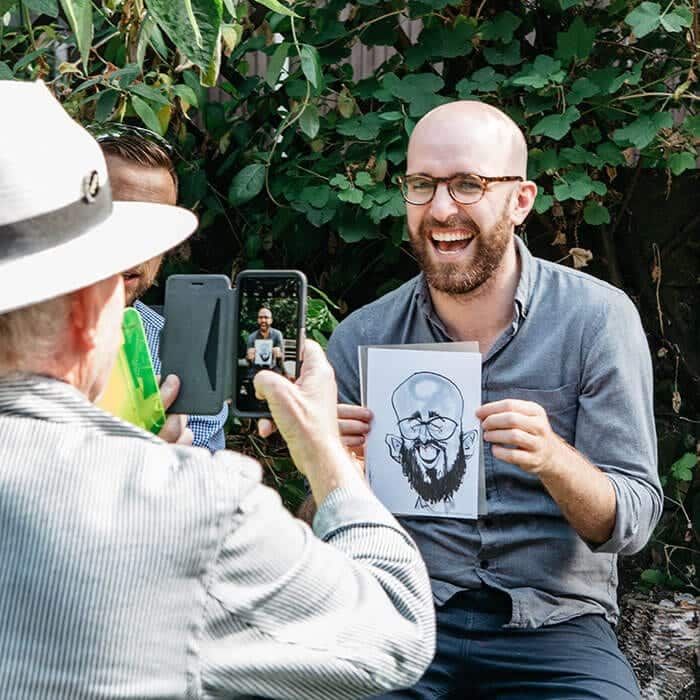 Caricaturist drawing a portrait at an event