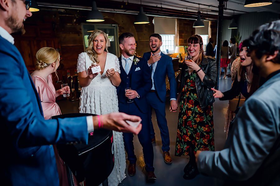 Drinks reception magician — wedding guests reacting