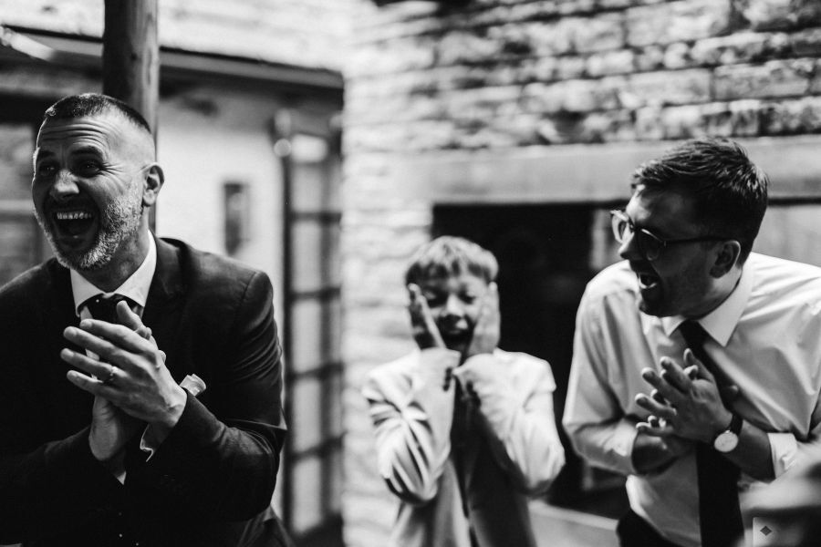 Close-up magician performing card tricks for guests