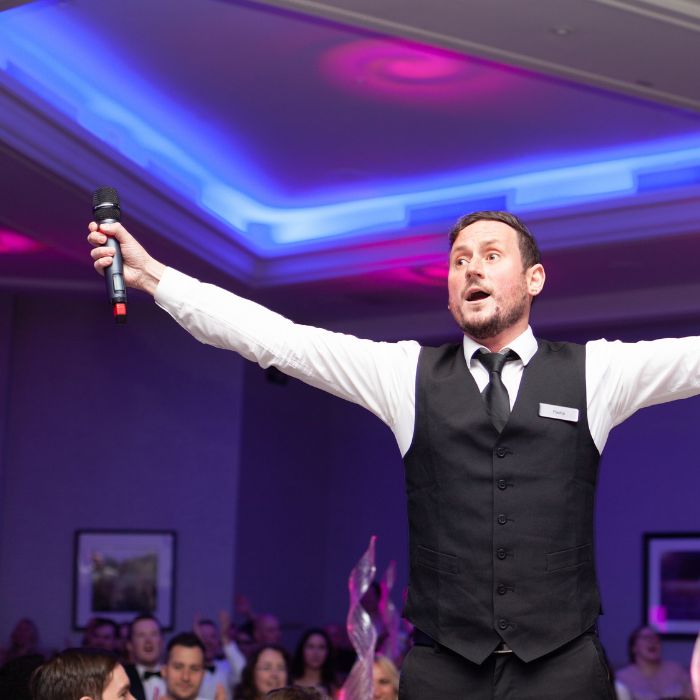 Singing waiters performing at a wedding reception
