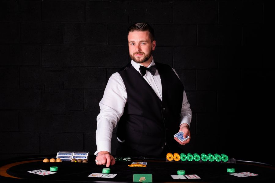 The Crooked Croupier dealing cards at a corporate casino night
