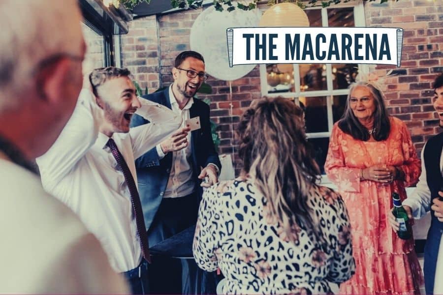 Wedding guest reacting with theatrical gestures during close-up magic