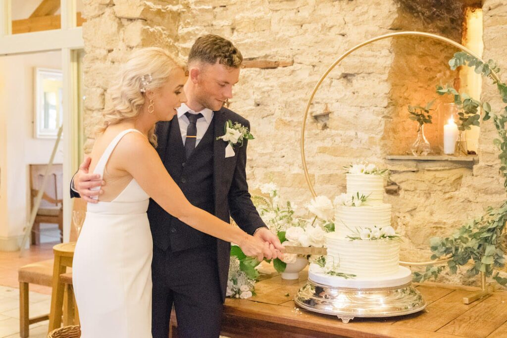 The wedding cake cutting at the reception