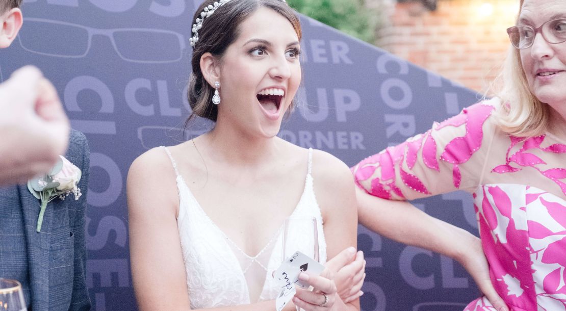 Wedding guests reacting to a magic trick
