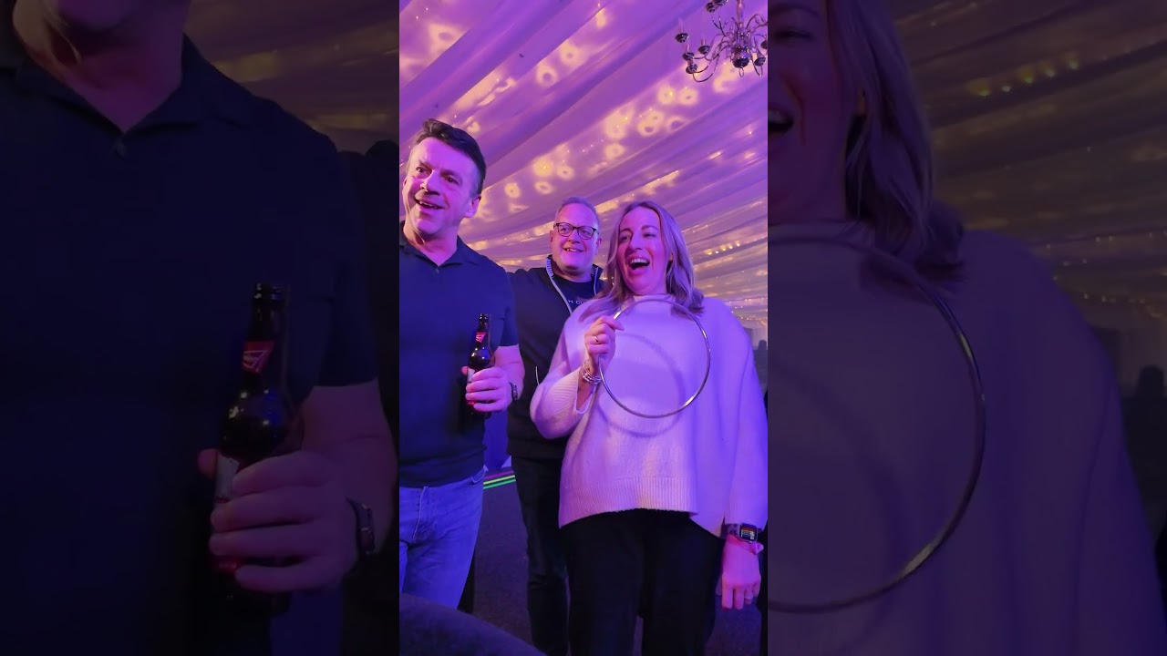 Close-up magician performing at an event in the Midlands