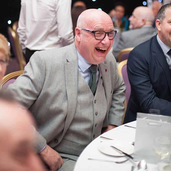 guests laughing at corporate evening