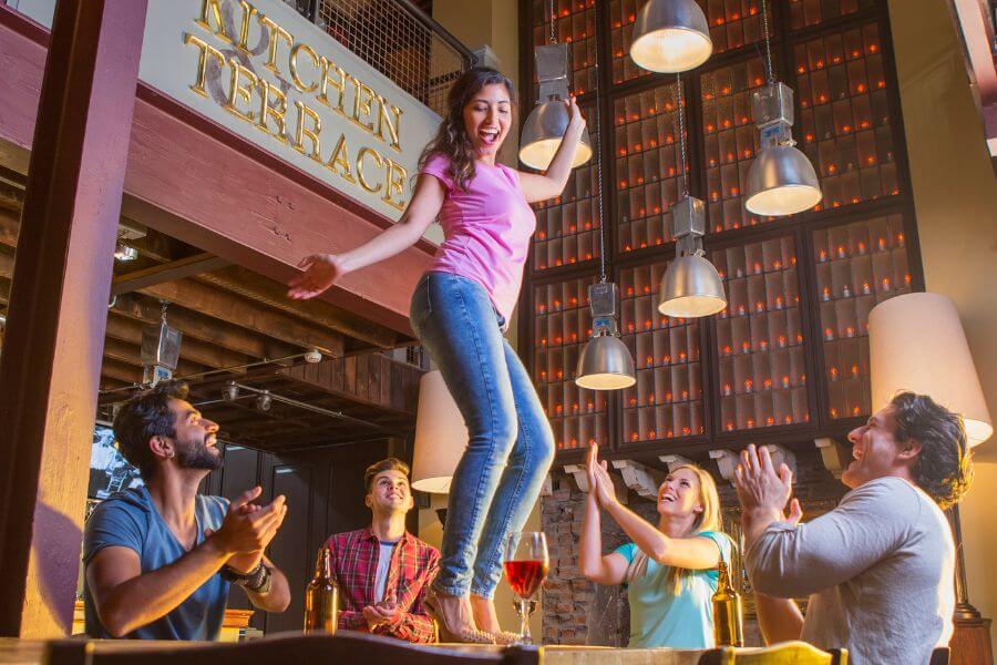 girls dancing on table