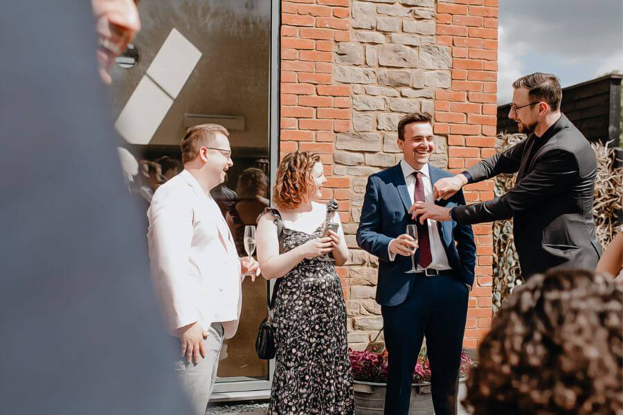 wedding magician works the crowd