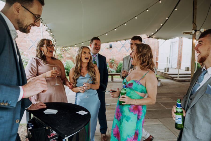 Wedding guest reacting to close-up magic at Alrewas Hayes