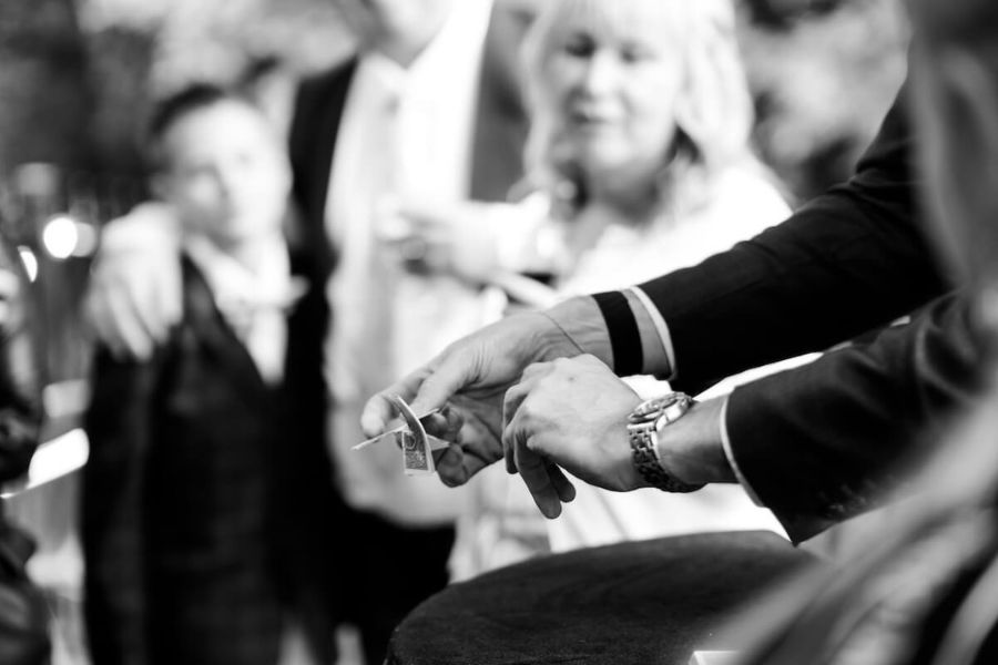 Close-up of a card trick performed at a wedding