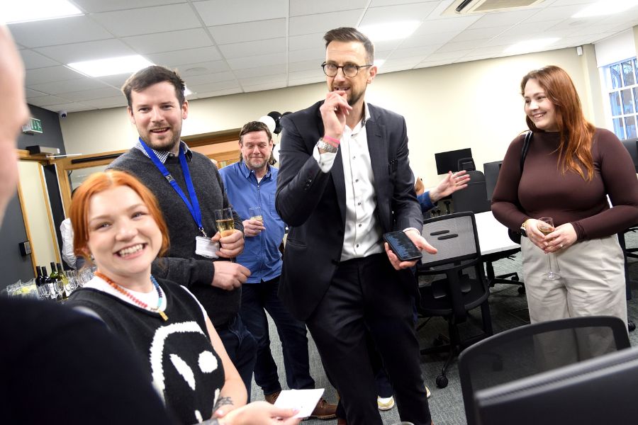 Close-up magician performing for guests at the Co-Founded launch