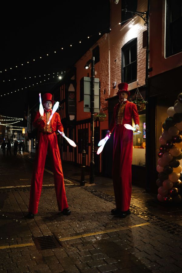Stilt-walking performers at the cocktail bar launch