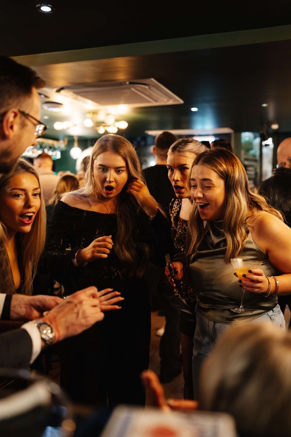 Close-up magician at a Christmas party