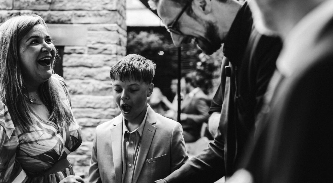 A bride greeting guests during the wedding reception