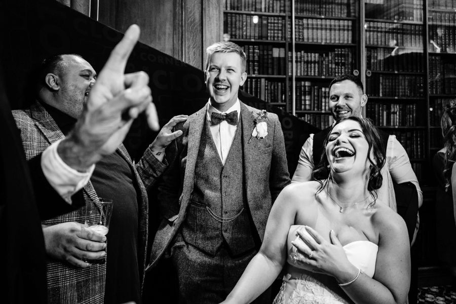 Bride laughing during a close-up magic performance