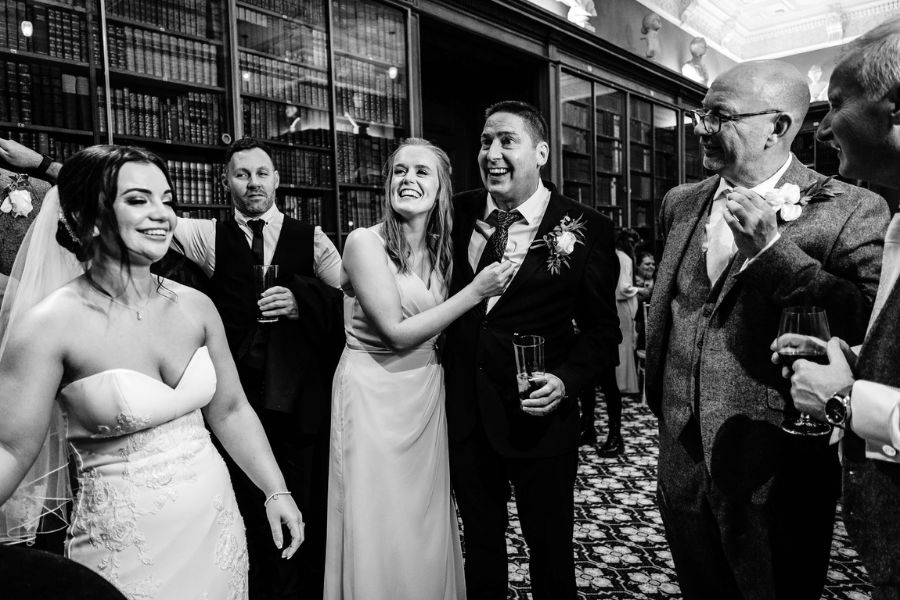 Guests amazed by close-up magic at a wedding