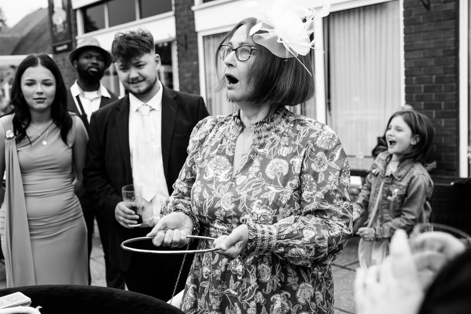 Ruth bringing other wedding guests over to watch close-up magic